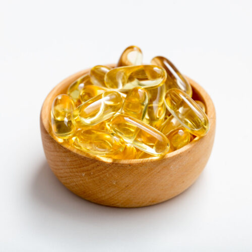 Fish oil capsules with omega 3 and vitamin D. healthy diet concept